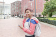 © leonardo2011 - Smiling sport woman with headphones and smart phone.