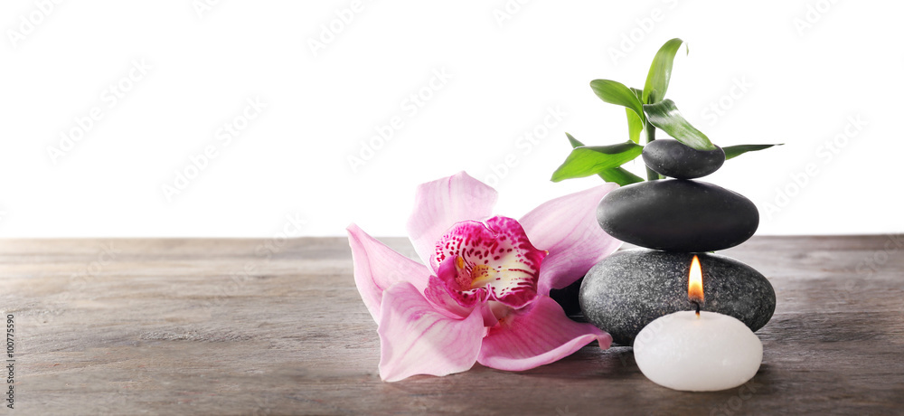 Spa still life with beautiful flower and candlelight on white background