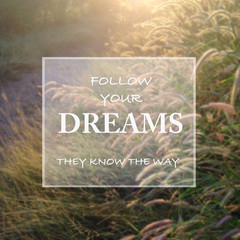 motivational quote : FOLLOW YOUR DREAMS on blur background