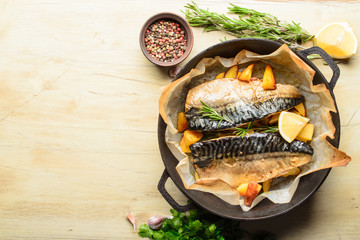 Wall Mural - Grilled mackerel fish with baked potatoes