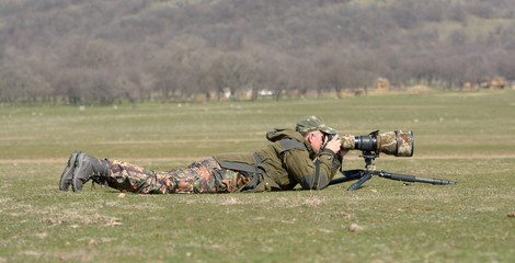 Wall Mural - wildlife photographer outdoor in action
