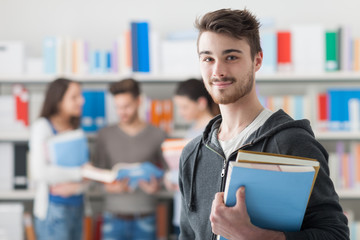 Confident student posing in the library