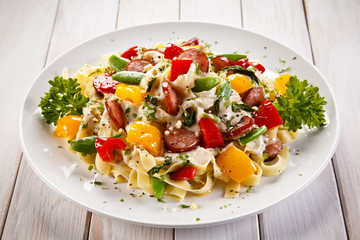 Wall Mural - Pasta with sausages and vegetables 