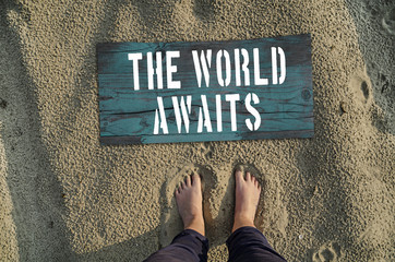 The world awaits. Motivational poster. Travel concept.