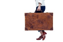 Midsection Of Woman Holding Luggage