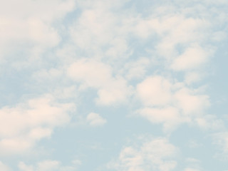 soft white and blue sky in background. clouds.