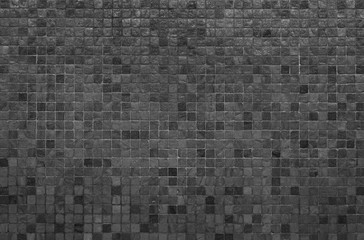 Grey and black mosaic wall texture and background..