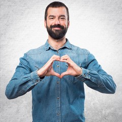 Wall Mural - Man making a heart with his hands