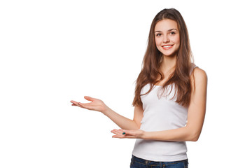 Smiling woman showing open hand palm with copy space for product or text