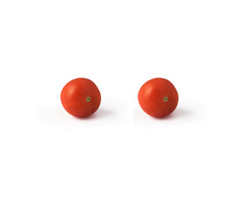 Two tomatoes isolated on white background