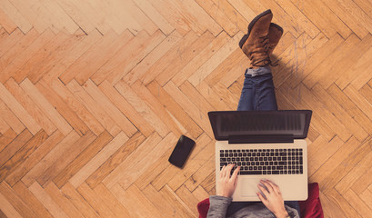 Modern workspace - girl with laptop working.