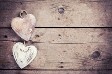 Two  Rustic Decorative  Hearts On Vintage Wooden Background