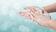 Washing hands. Hygiene concept. Blue bokeh background.