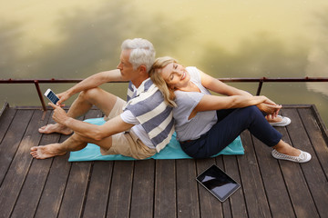 Wall Mural - Senior couple relaxing outdoor