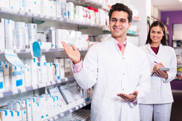 Wall Mural - Young team in chemist shop