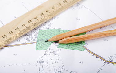 Topographic map and pencils close up