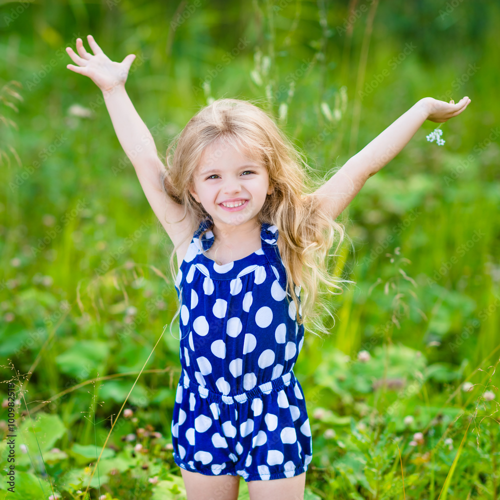 Cute Little Toddler Girl With Curly Hair Wearing A Blue Summer Dress Having  Fun During Easter Egg Hunt Relaxing In The Garden On A Sunny Spring Day  Stock Photo, Picture and Royalty, image size:1000x1000
