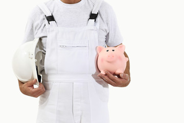 Wall Mural - painter man with white helmet and piggy bank, isolated on white,