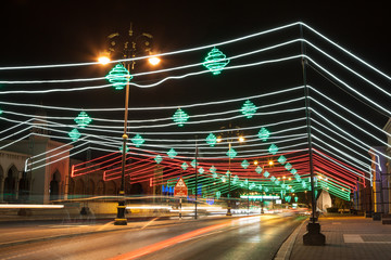 Fototapete - Street in Muscat decorated with lights. Oman, Middle East