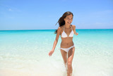 Fototapeta  - Cheerful Woman Running at Beach Summer Fun