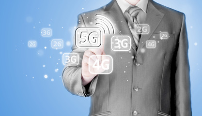 Wall Mural - businessman holding in hand 5G, technology background