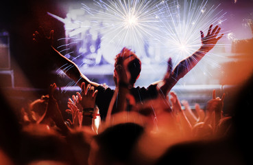 Fireworks at a live concert. Cheering crowd