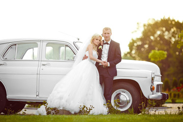 beautiful gorgeous blonde bride and stylish groom on the backgro