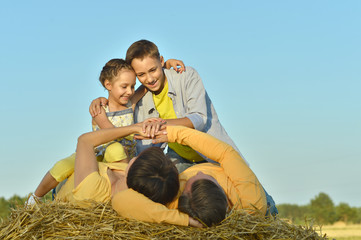 Wall Mural - Happy family in wheat field