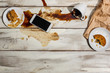 Cup of coffee spilled on wooden table