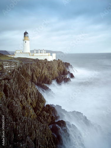 Fototapeta na wymiar Long Exposure Storm Sea Lighthouse Cliffs