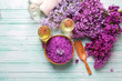 Organic aroma oils, sea salt,  lilac flowers  on turquoise paint