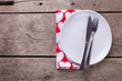  Napkin with hearts, knife and fork on white plate on vintage wo
