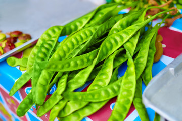 Wall Mural - Healthy Food Ingredient. Close Up Of Organic Fresh Green Asian Bitter Bean ( Stink Bean, Petai, Parkia Speciosa, Twisted Cluster Bean ) In The Farmers Market In Thailand, Asia. Vegetables Eating.