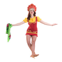 Wall Mural - Young woman wearing a folk costumes dancing.  Isolated on white in full length with copyspace