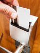 Person's Hand Unlocking Hotel Room Keycard Lock