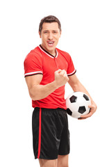 Sticker - Happy football player holding a ball