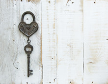 Heart And Key On White Wooden Background
