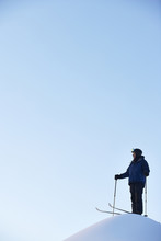Caucasian Skier On Hilltop
