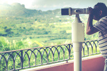 Man Looking On Mountains With Telescope