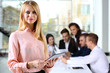© Africa Studio - Young business woman at the meeting in a conference room