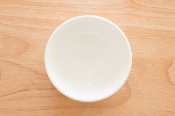 Empty bowl on a wooden board