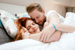 © NDABCREATIVITY - Beautiful happy couple in bed