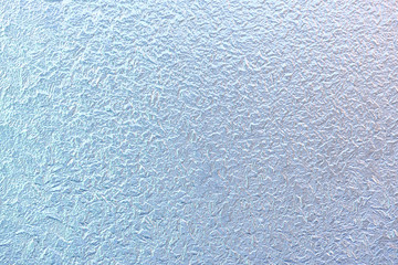 Frost patterns on window glass in winter. Frosted Glass Texture. Blue