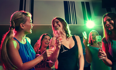 Poster - young women with glasses of champagne in club