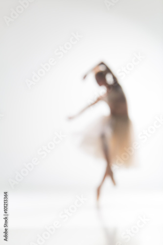 Vászonkép Blurred silhouette of ballerina on white background