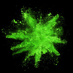 Wall Mural - Explosion of green powder on black background