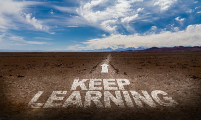 Keep Learning written on desert road