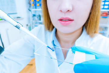 Poster - scientist woman in genetic laboratory