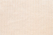 © Konstantin Aksenov - Abstract knitted background. Wool beige sweater texture. Close up
