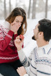 © sergiubirca - Handsome caucasian man doing a marriage proposal on bright winter day in the park for the valentines day